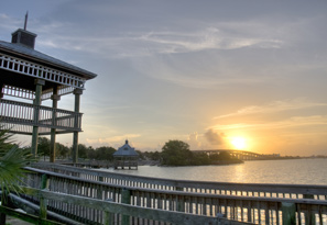 A sunset at Cocoa, FL over a distant bridge